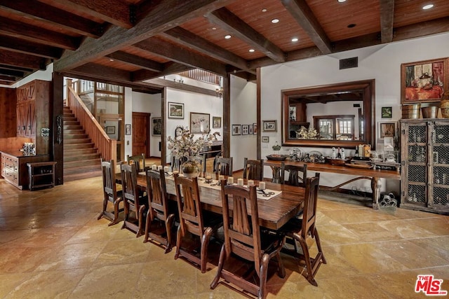 dining area featuring beamed ceiling and wooden ceiling