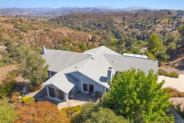 birds eye view of property with a mountain view