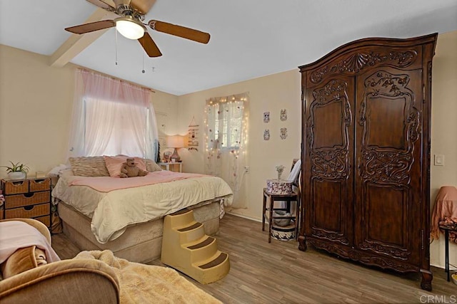 bedroom featuring ceiling fan and hardwood / wood-style floors