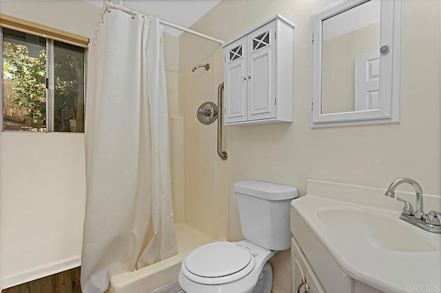 bathroom with vanity, hardwood / wood-style floors, curtained shower, and toilet