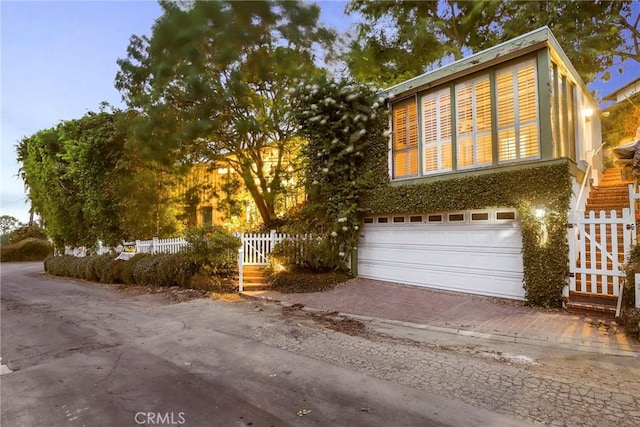 view of front of home with a garage