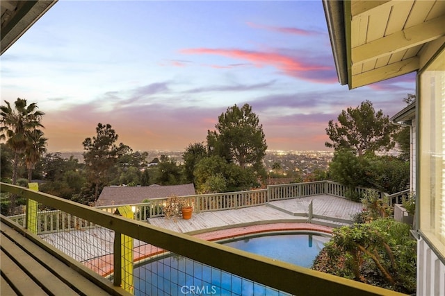 view of pool at dusk