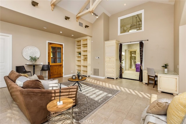 tiled living room featuring beam ceiling, high vaulted ceiling, and built in shelves