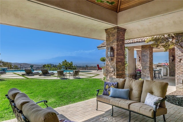 view of patio with a mountain view and an outdoor hangout area