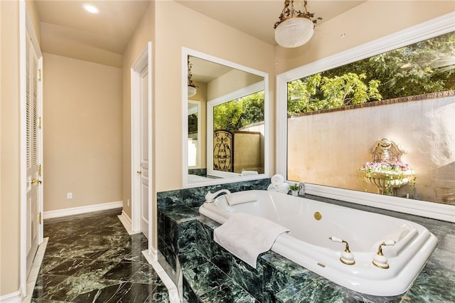 bathroom featuring tiled bath