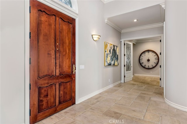 entryway featuring crown molding