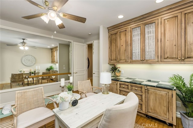 dining area featuring ceiling fan and hardwood / wood-style flooring