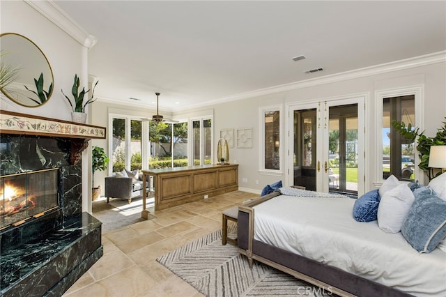 bedroom with french doors, crown molding, and access to outside