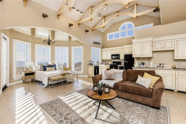 living room with beamed ceiling, beverage cooler, high vaulted ceiling, light tile patterned floors, and an inviting chandelier