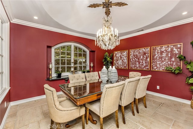 dining room with crown molding and an inviting chandelier