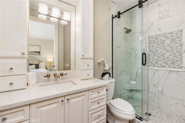 bathroom featuring vanity, an enclosed shower, and toilet