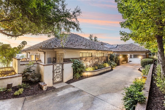 mediterranean / spanish house featuring a garage