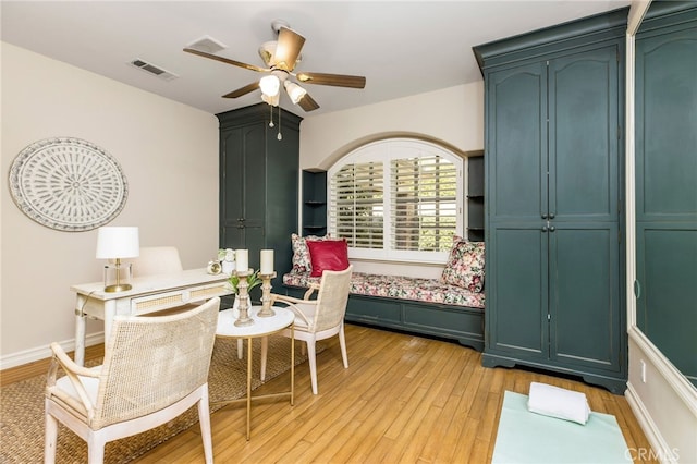 bedroom with light hardwood / wood-style flooring and ceiling fan