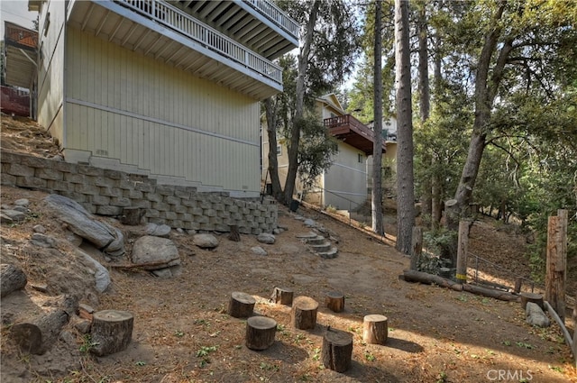 view of property exterior featuring a balcony