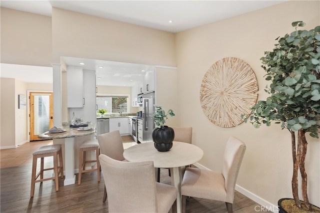 dining room featuring dark hardwood / wood-style floors