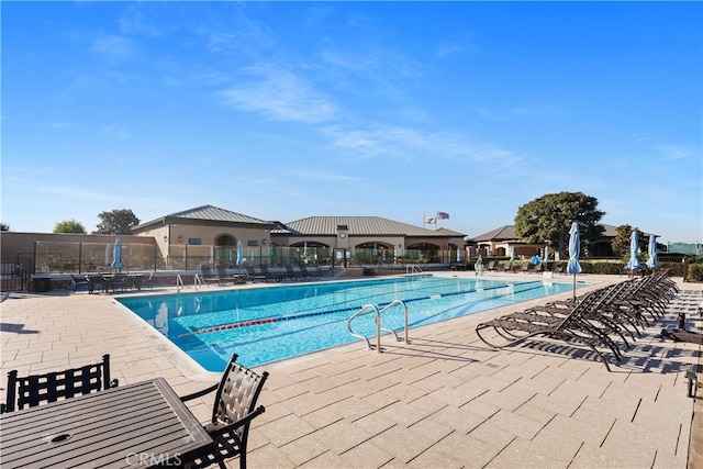 view of swimming pool featuring a patio area