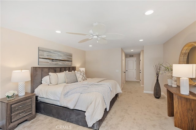 bedroom with light colored carpet and ceiling fan