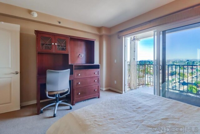 carpeted bedroom featuring access to outside