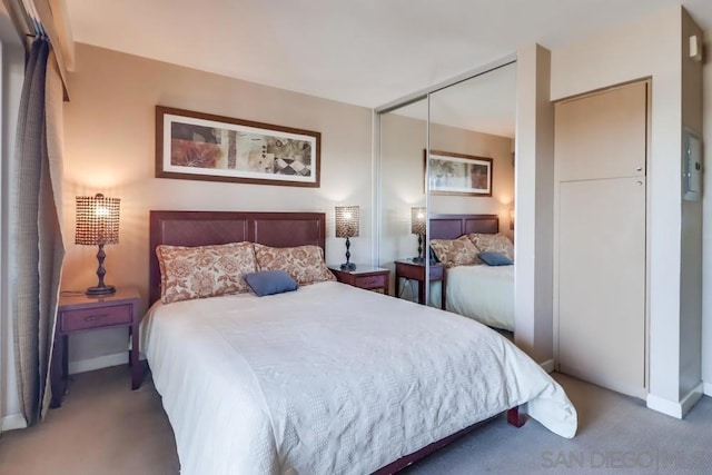 carpeted bedroom with a closet