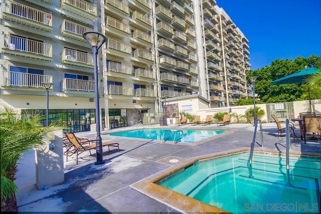 view of swimming pool featuring a patio area