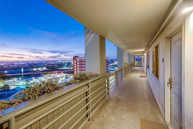 view of balcony at dusk