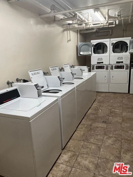 clothes washing area featuring independent washer and dryer and stacked washing maching and dryer