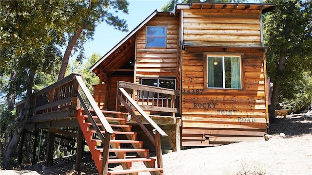 exterior space featuring a wooden deck