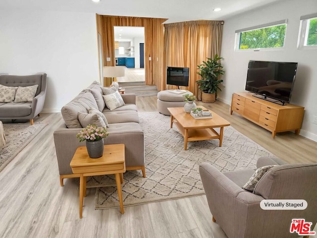 living room with light hardwood / wood-style flooring