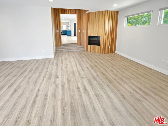 unfurnished living room with light hardwood / wood-style flooring