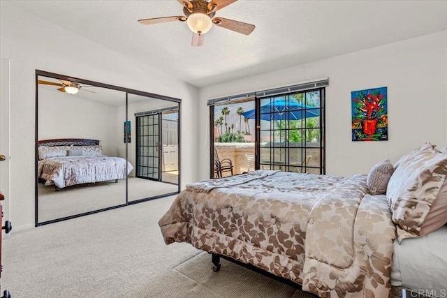 carpeted bedroom with ceiling fan, a closet, access to outside, and vaulted ceiling