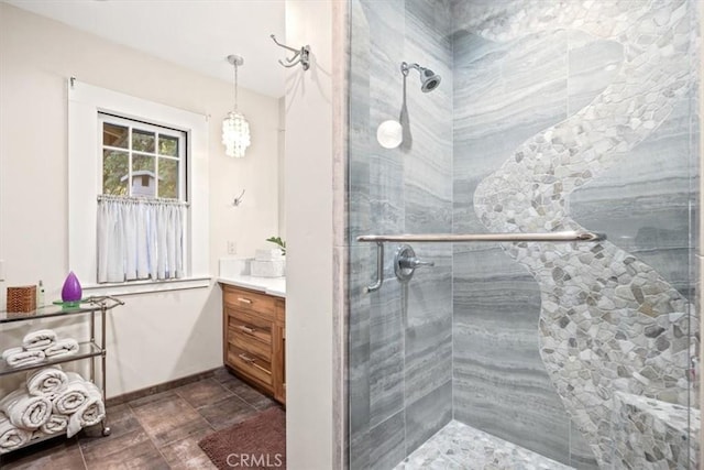 bathroom featuring vanity and a shower with door