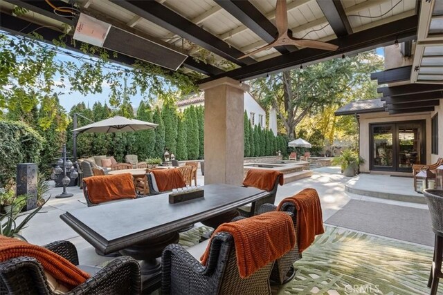 view of patio / terrace with ceiling fan and french doors