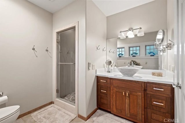 bathroom featuring vanity, toilet, tile patterned floors, and an enclosed shower