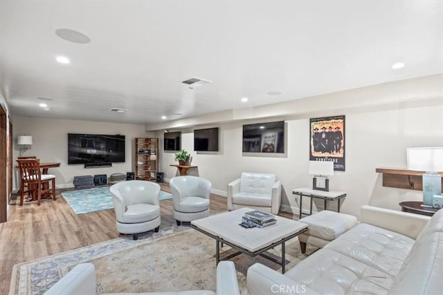 living room with light hardwood / wood-style flooring