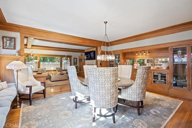 dining space featuring crown molding and hardwood / wood-style floors