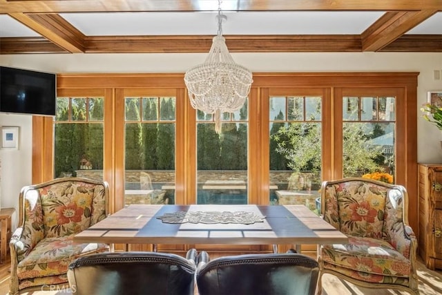 sunroom / solarium featuring beam ceiling, french doors, and coffered ceiling