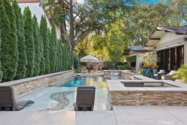 view of swimming pool featuring a patio area, outdoor lounge area, and an in ground hot tub