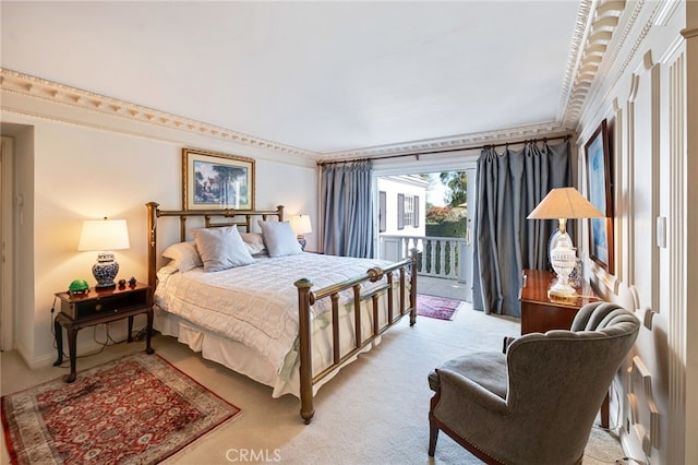 bedroom featuring crown molding, light colored carpet, and access to outside