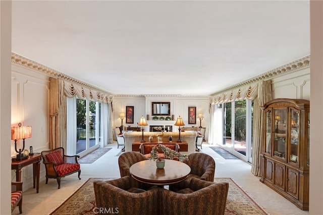 carpeted dining room featuring ornamental molding