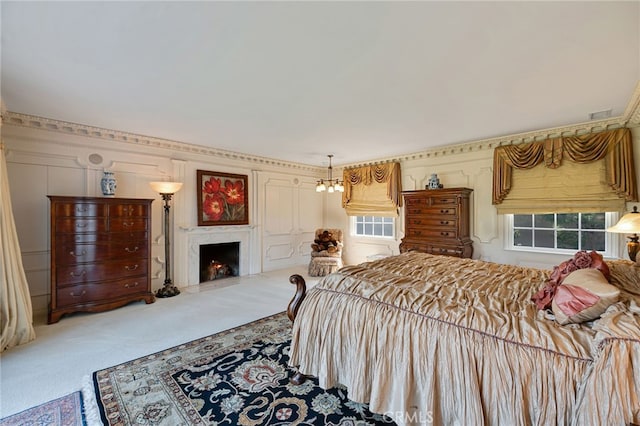 bedroom with an inviting chandelier and carpet flooring