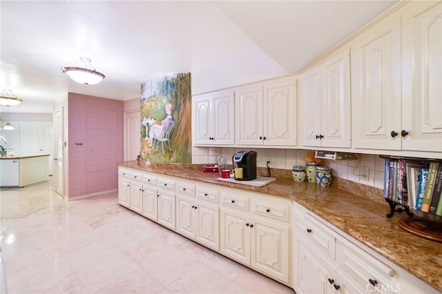 kitchen with white cabinetry, dishwasher, tasteful backsplash, and stone countertops