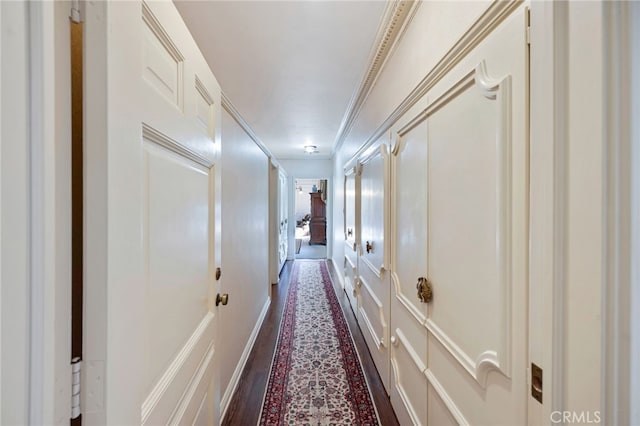 hallway featuring crown molding