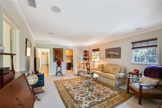 living room with light carpet and crown molding