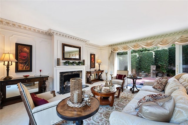 carpeted living room with a high end fireplace