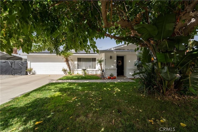 ranch-style home with a garage and a front yard