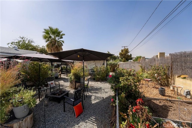 view of patio / terrace featuring an outdoor fire pit