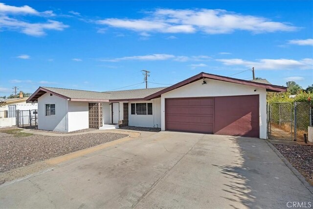 single story home featuring a garage