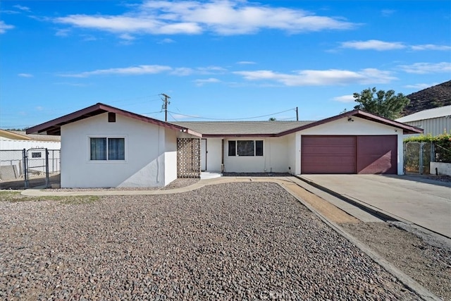 ranch-style house featuring a garage