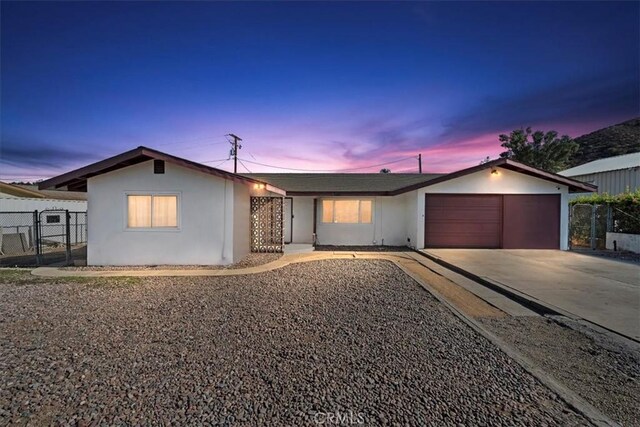 ranch-style home featuring a garage