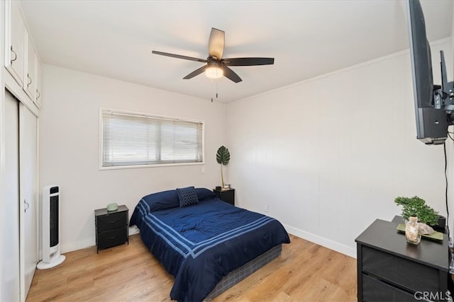 bedroom featuring light hardwood / wood-style floors and ceiling fan